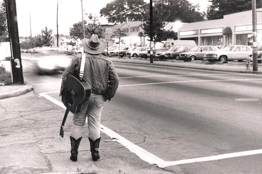 MILES TO GO: With the Star Community Bar to his left, and Wax ’N’ Facts to his right, Slim Chance (James Kelly) contemplates being in Little Five Points.